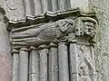 Saint Eligius as patron saint of smiths on the north portal of Öja Church on Gotland with hammer and tongs; 14th century.