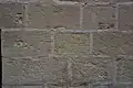 Graffiti etched into the walls by the prisoners