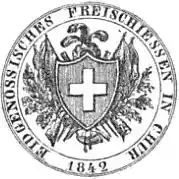 Obverse of coin. A shield bearing the Swiss Cross in front of flags, branches and rifles. Above the shield is a crown with three feathers. A powder horn is suspended below. Inscription and date around outer edge.