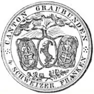 Reverse of coin. Three ovals, each depicting coats of arms. Above the ovals are two clasped hands emerging from clouds, surrounded by rays. Below are two intersected branches