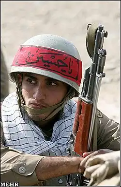 A Chinese Type 56 bayonet affixed to an AK rifle