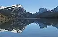 White Rock (left), Squaretop Mountain (right) reflected in Green River Lakes. White Rock is a dolomite and limestone cliff that rises 3,300 feet above the lake.