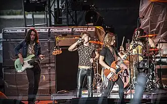 The band onstage at the 2017 Red River Valley Fair in West Fargo, North Dakota (L–R: Sam Kiszka, Josh Kiszka, Jake Kiszka, Danny Wagner)