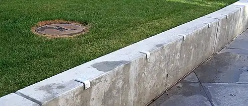 Ledge with skatestoppers preventing skateboarders from grinding