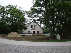 A building in the hamlet with a penny bun painted on it