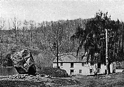 This 1747 grist mill supplied flour to the Continental Army at Valley Forge. The boulder (left) has a plaque from 1892. Photograph c.1922.