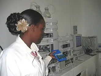 Image 6A technician at the Guyana Food and Drug Department Laboratory in Georgetown, Guyana selecting peanut samples to be tested with new equipment. (from Agriculture in Guyana)