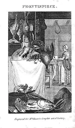 View of a kitchen showing game hanging and fish lain out