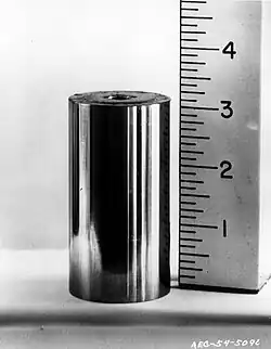 A metal cylinder with a ruler next to it, 3.1&nbsp;cm high