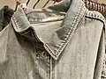 Denim jacket, the loop has the manufacturer's logo