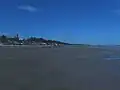 To the north of the beach