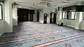 The main prayer hall of the mosque, located on the second level.