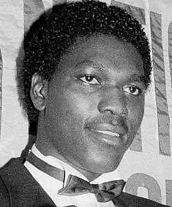 A man wearing a suit and a white shirt.