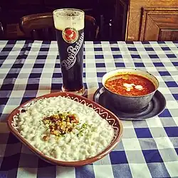Image 33Halušky with bryndza cheese, kapustnica soup and Zlatý Bažant dark beer—examples of Slovak cuisine (from Culture of Slovakia)