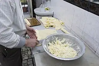 Halawet al-jibn being prepared in Hama, with cream filling