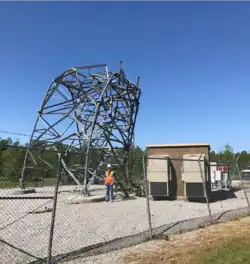A cell tower that was bent in half by the tornado