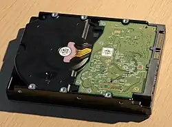 The circuit board of a Western Digital hard drive attached to its chassis