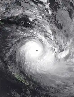Infrared satellite image of Cyclone Harold featuring a clear eye and a large rainband to its south