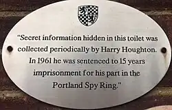 Plaque reading "Secret information hidden in this toilet was collected periodically by Harry Houghton. In 1961 he was sentenced to 15 years imprisonment for his part in the Portland Spy Ring."