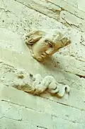 Protruded head on a wall