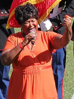 Miller singing "The Star-Spangled Banner" at Mile High Stadium in 2014