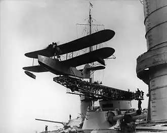 A Soviet Naval Aviation Heinkel KR-1 flying boat launches from a&nbsp;catapult mounted on a&nbsp;Parizhskaya Kommuna's 12-inch (305&nbsp;mm) gun turret, 1930–1933