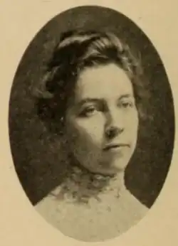 A young white woman with hair in an updo, in an oval frame