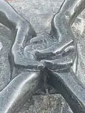Close up view of Helping Hands granite sculpture