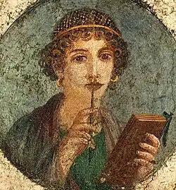 Image 6Woman holding wax tablets in the form of the codex. Wall painting from Pompeii, before 79 CE. (from History of books)