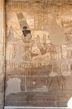 A relief showing Darius I offering lettuces to the Egyptian deity Amun-Ra Kamutef, Temple of Hibis