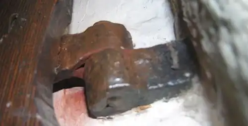 A barrel hinge made of wrought iron