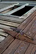Rusty hinges on a building exterior
