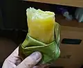 Steamed glutinous rice cakes made from brown rice and sometimes tapioca with banana