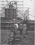 A Kannushi performs a shrine Tamagushi ceremony during the construction of the shamusho (社務所) of the Hirohara shrine (c. 1944)[6]