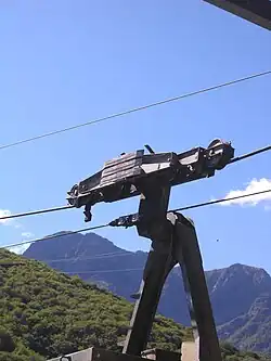 Aerial tramway from Intragna to Rasa, Ticino, Switzerland.The lower cable is used for pulling. The middle cable supports the weight of gondola.The role of the third cable is not clear