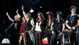 Hollywood Vampires at Wembley Arena on June 20, 2018. (L-R: Chris Wyse, Buck Johnson, Johnny Depp, Alice Cooper, Joe Perry, Tommy Henriksen and Glen Sobel)