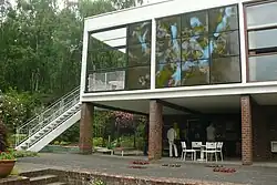 Stairs down from the dining room balcony to the terrace
