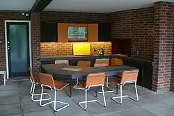 The outdoor kitchen, part of the loggia beneath the living room wing