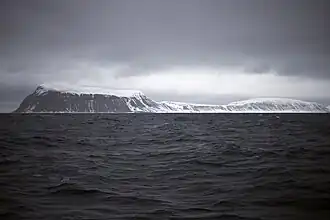 The southernmost point, Kapp Thor, and the highest point, Iversenfjellet (370&nbsp;m) seen from south