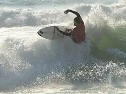 A surfer at Soorts-Hossegor, considered as one of the best surfing spots in the world.[135]