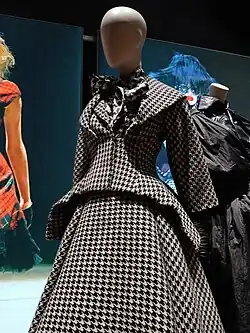 Woman's black and white skirt suit with neck bow