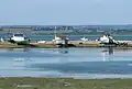 Beached hull house boats on Hayling Island, England