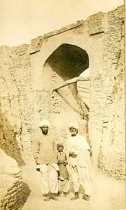 Two Sindhi men and a boy in Sindhi Suthan/Salwar, Pehran, Patka, Loi (Sindhi shawl), and cap and jacket