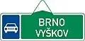 VII-2b Route indicator with direction via road for motor vehicles (two destination) (old)
