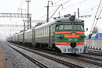Green-and-orange electrified train
