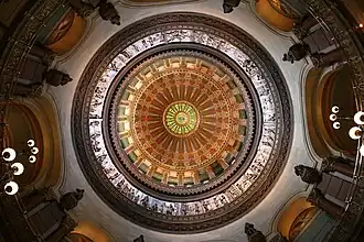 Image 18The dome of the Illinois State Capitol. Designed by architects Cochrane and Garnsey, the dome's interior features a plaster frieze painted to resemble bronze and illustrating scenes from Illinois history. Stained glass windows, including a stained glass replica of the State Seal, appear in the oculus. Ground was first broken for the new capitol on March 11, 1869, and it was completed twenty years later. Photo credit: Daniel Schwen (from Portal:Illinois/Selected picture)