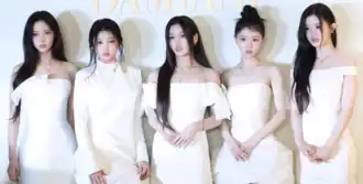 Illit in white dress in January 2026