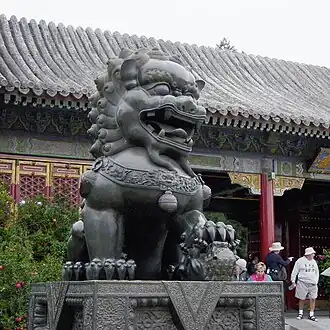 Female guardian lion with her cub at the Summer Palace of Beijing