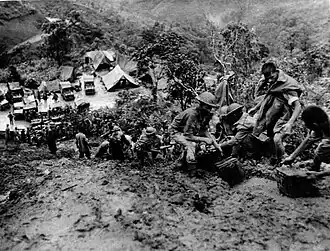 Moving ammunition in muddy conditions on road to Tamu