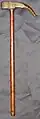 Indo-Persian war hammer, heavy iron head with a hammer in front, a 4.5-inch (11&nbsp;cm) curved spike on the other side, cut channel decorations, hard wood shaft